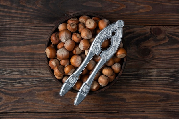 Nuts in wood bowl wooden backround