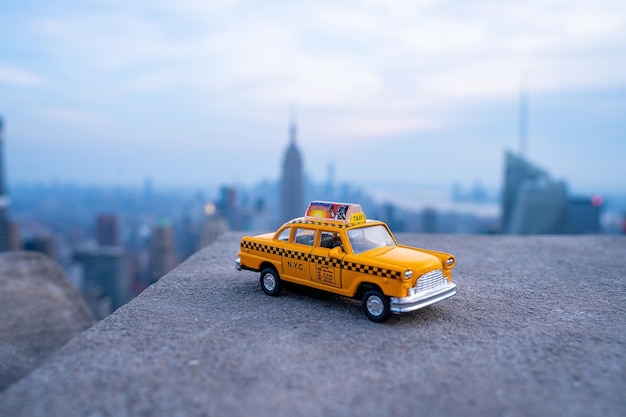 NYC taxi model parked on the streets of New York