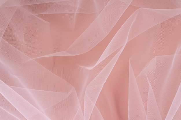 Nylon transparent fabric on a beige background. Selective focus.