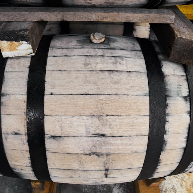 Photo oak barrels stacked with tequila ready for maturation