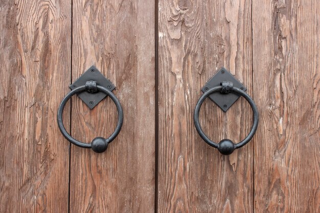 Oak doors with wrought iron handles in the form of rings