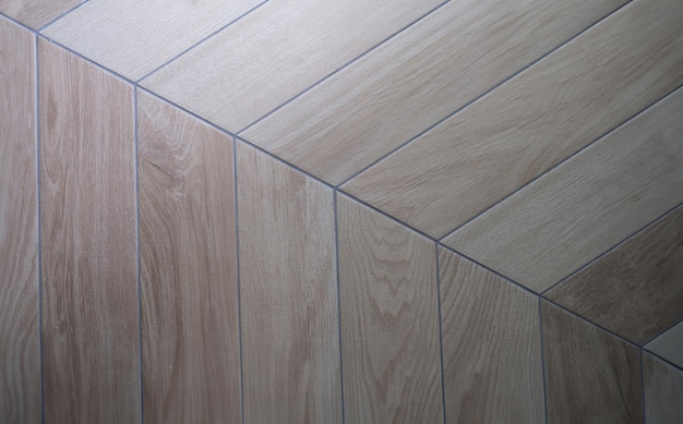 Photo oak texture of floor with tiles imitating parquet