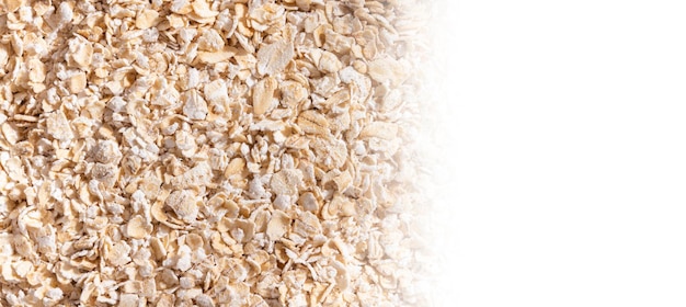 Oat flakes closeup on white background