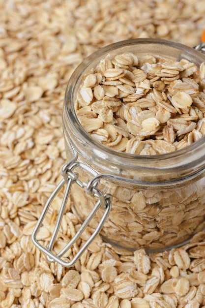 Photo oat flakes in jar. healthy food. texture. side view.