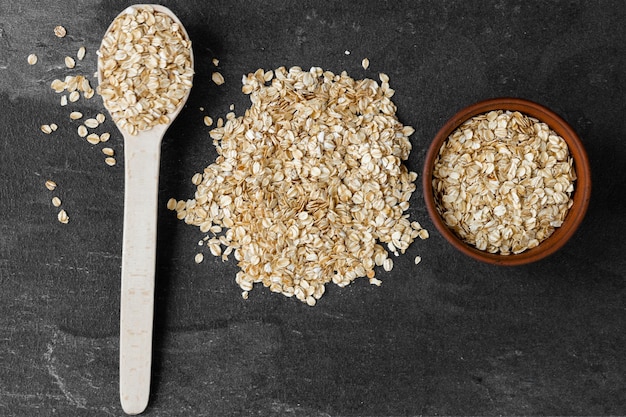 Oat flakes oats or rolled oats in bowl Table top view