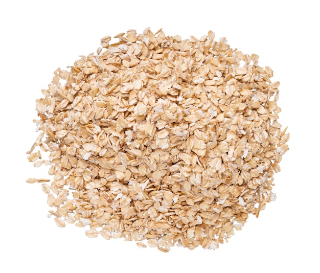 Oat flakes pile top view, isolated on white background