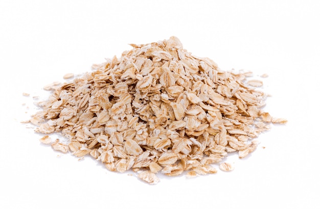 Oat flakes pile on white background