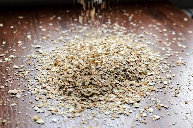 Photo oat flakes sprinkled on the table