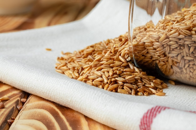 Oat grain scattered on kitchen napkin