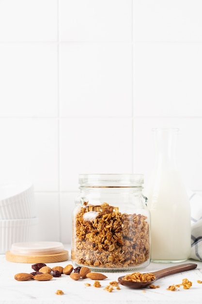 Oat granola with nuts and dried fruits on a jar