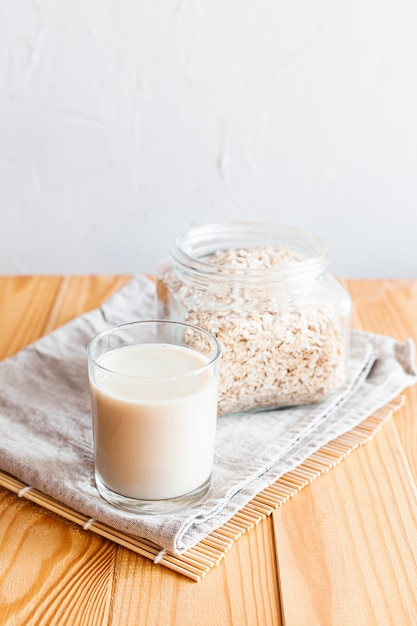 Oat milk in a glass on a table