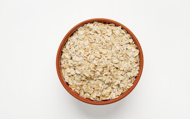 Oatmeal in bowls and bags isolated on a white background High quality photo