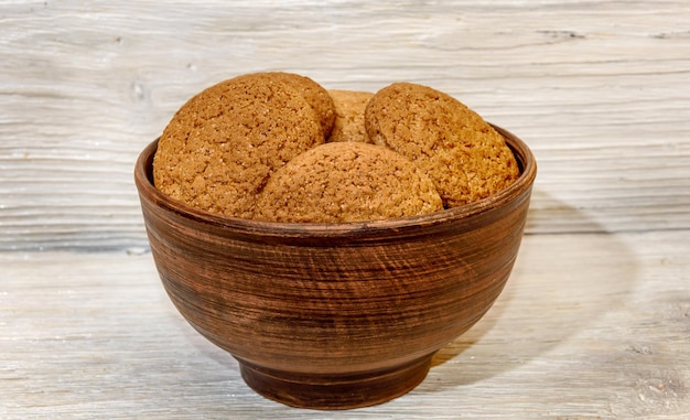 Oatmeal cookies in a clay bowl