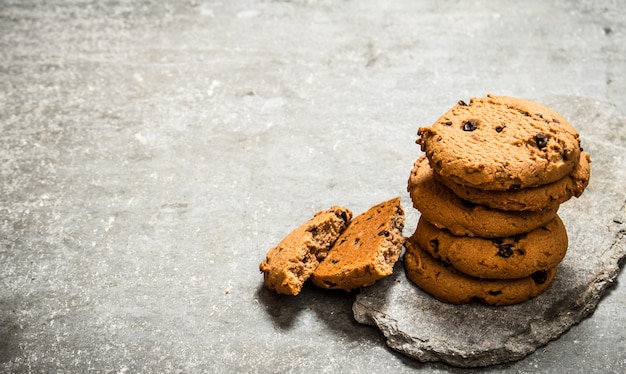 Oatmeal cookies on a stone stand. On the stone table.