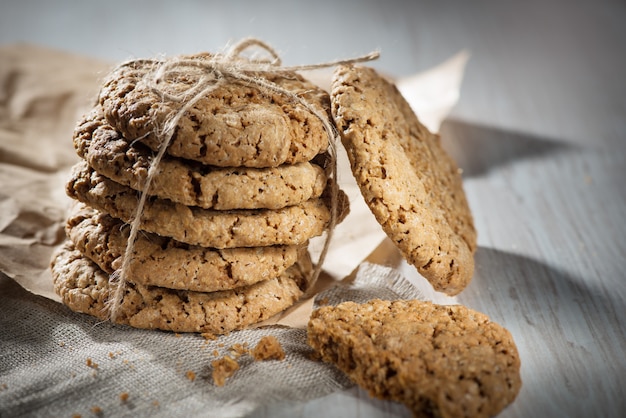 Oatmeal cookies tied with a rope on the table