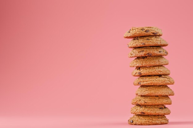 Oatmeal cookies with chocolate are stacked on a