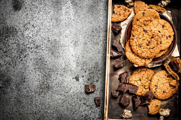 Oatmeal cookies with chocolate in a bowl.