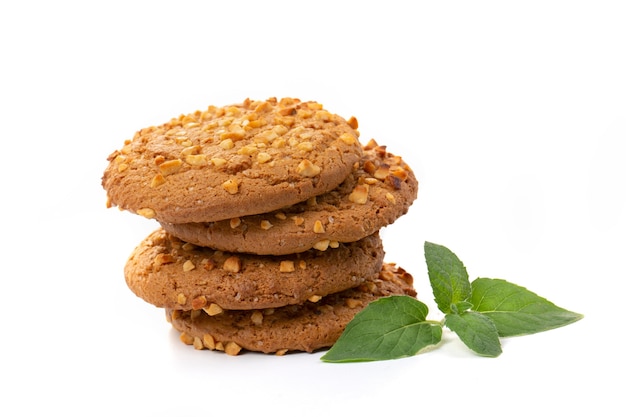 Oatmeal cookies with a green mint leaf on a white background. Diet food.