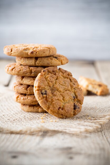 Oatmeal cookies with wooden background