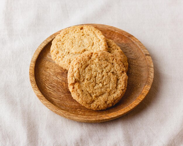 Oatmeal cookies on a wooden plate