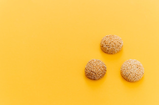 Oatmeal cookies on a yellow background