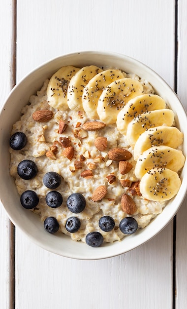 Oatmeal with banana blueberries almonds and honey Healthy food Vegetarian food Breakfast