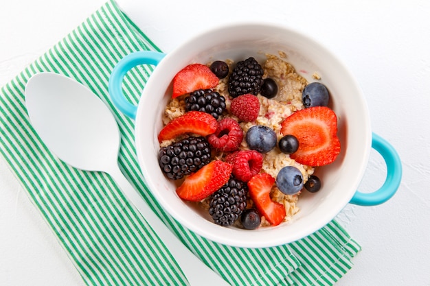 Oatmeal with different berries in a bowl