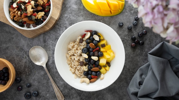 Oatmeal with dried fruits, nuts and mango