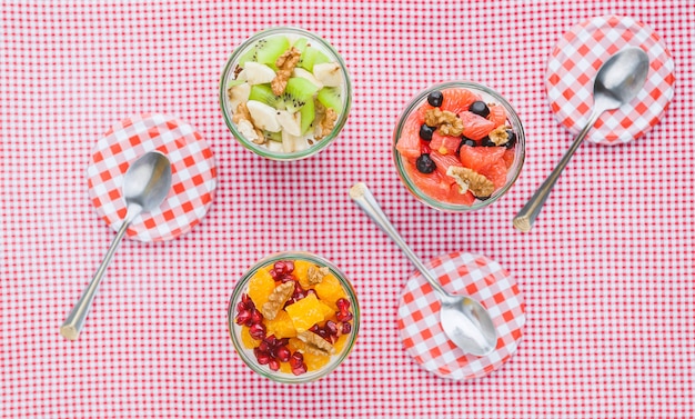 Oatmeal with fruit and cereals in a glass jar