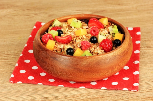 Oatmeal with fruits on table closeup