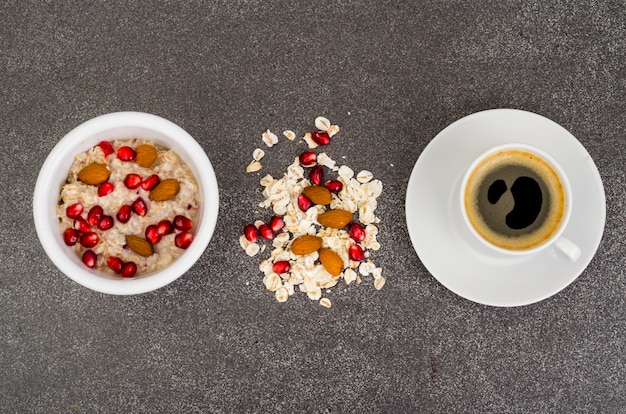 Oatmeal with pomegranate and nuts, and black coffee