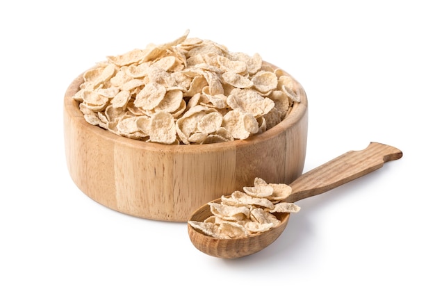 Oatmeal in wooden bowl and spoon on white