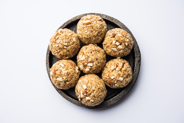 Oats laddu or Ladoo also known as Protein Energy balls. served in a plate or bowl. selective focus