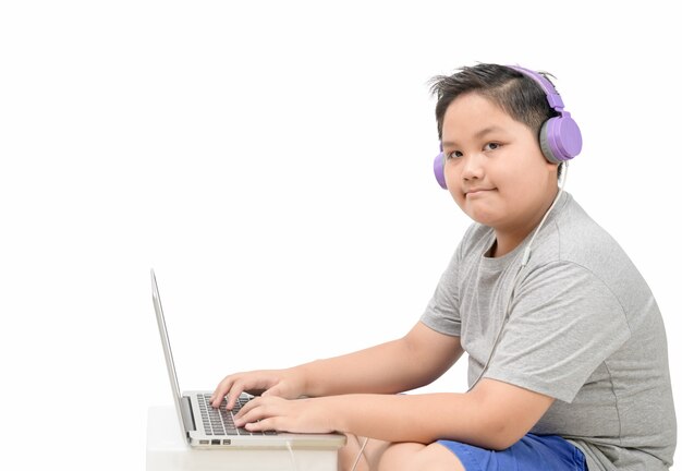 Obese boy student wear headphone study online with teacher isolated