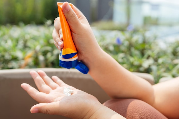 Obese Woman applying sunscreen cream Vacation Traveling with Body Sun protection suncream in hotel resort holiday