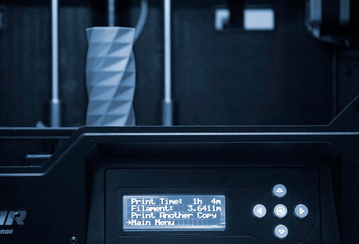 Photo the object printed d printer on a blue and black background