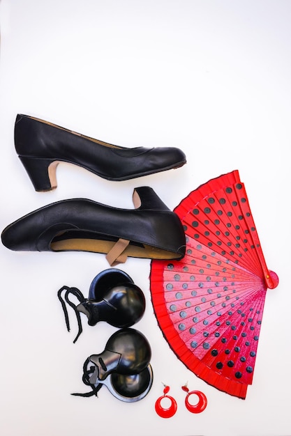 Objects used in the flamenco fan, castanets and high heeled shoes