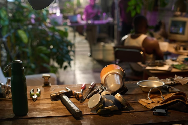 Objects on wooden table in postapocalyptic shelter