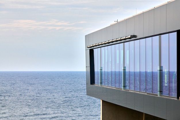 Observation deck with elevator lift, Baltic Sea background. Viewing platform for tourism, panoramic sea view in Svetlogorsk city. Elevator to sea promenade, modern futuristic architecture