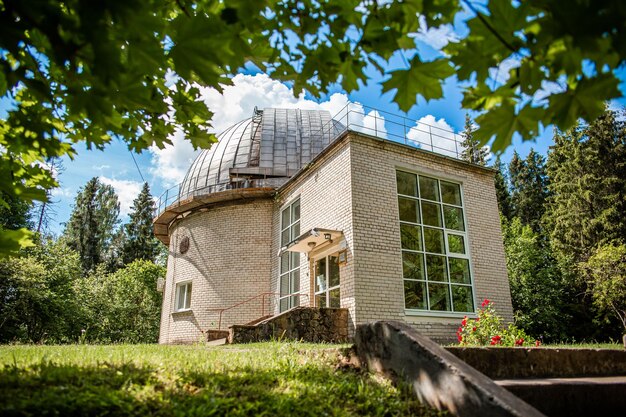 Photo observatory astronomical dome in forest