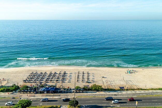 An ocean beach on the outskirts of a big city