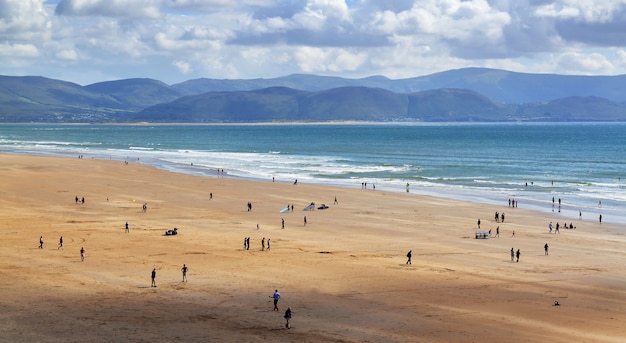 Ocean coastline in sunny day with people