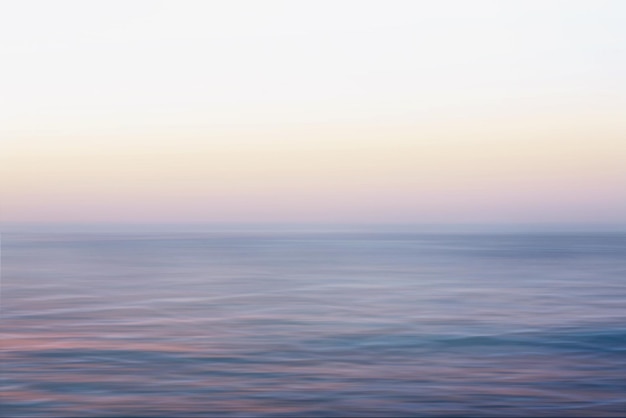 Photo ocean sea view, soft blur wave texture, cloud sky background, spring summer sunrise - sunset theme