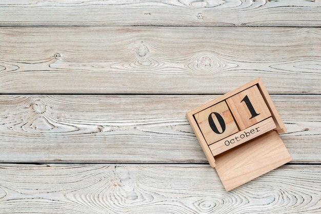 October 1st .October 1 white wooden calendar on  wood table