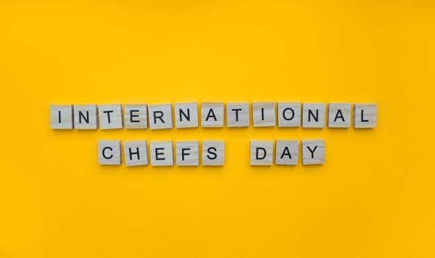 October 20 international chefs day minimalistic banner with the inscription in wooden letters