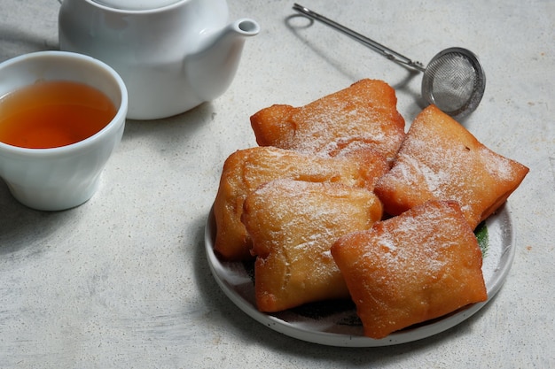 odading or beignet indonesian fried bread on white background