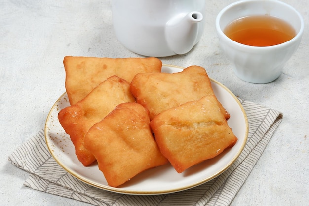 odading or beignet indonesian fried bread on white background