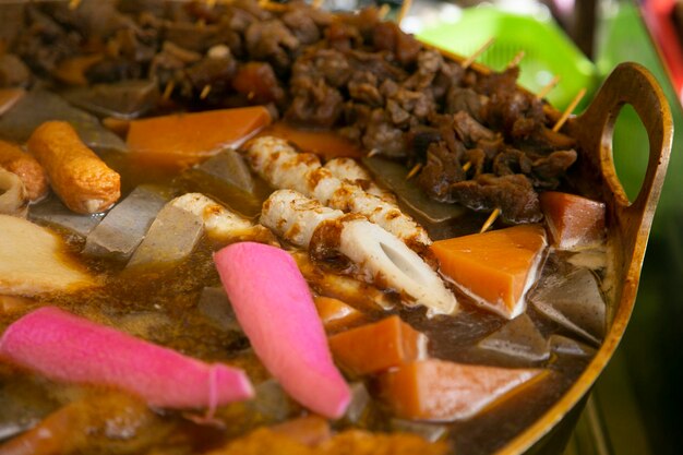 Photo oden is a type of nabemono thats traditionally cooked in a donabe clay pot and features japanese