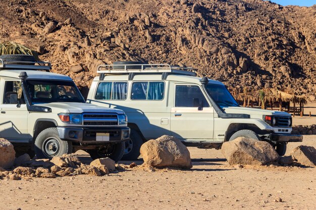 Off road SUV cars in bedouin village in Arabian desert near Hurghada Egypt