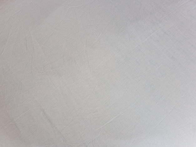 Sfondo di trama del tessuto di cotone bianco sporco